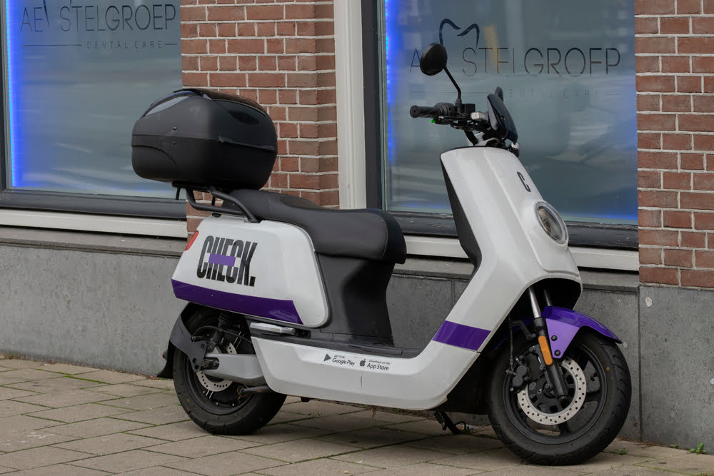 You can book check scooters very easily via Moves