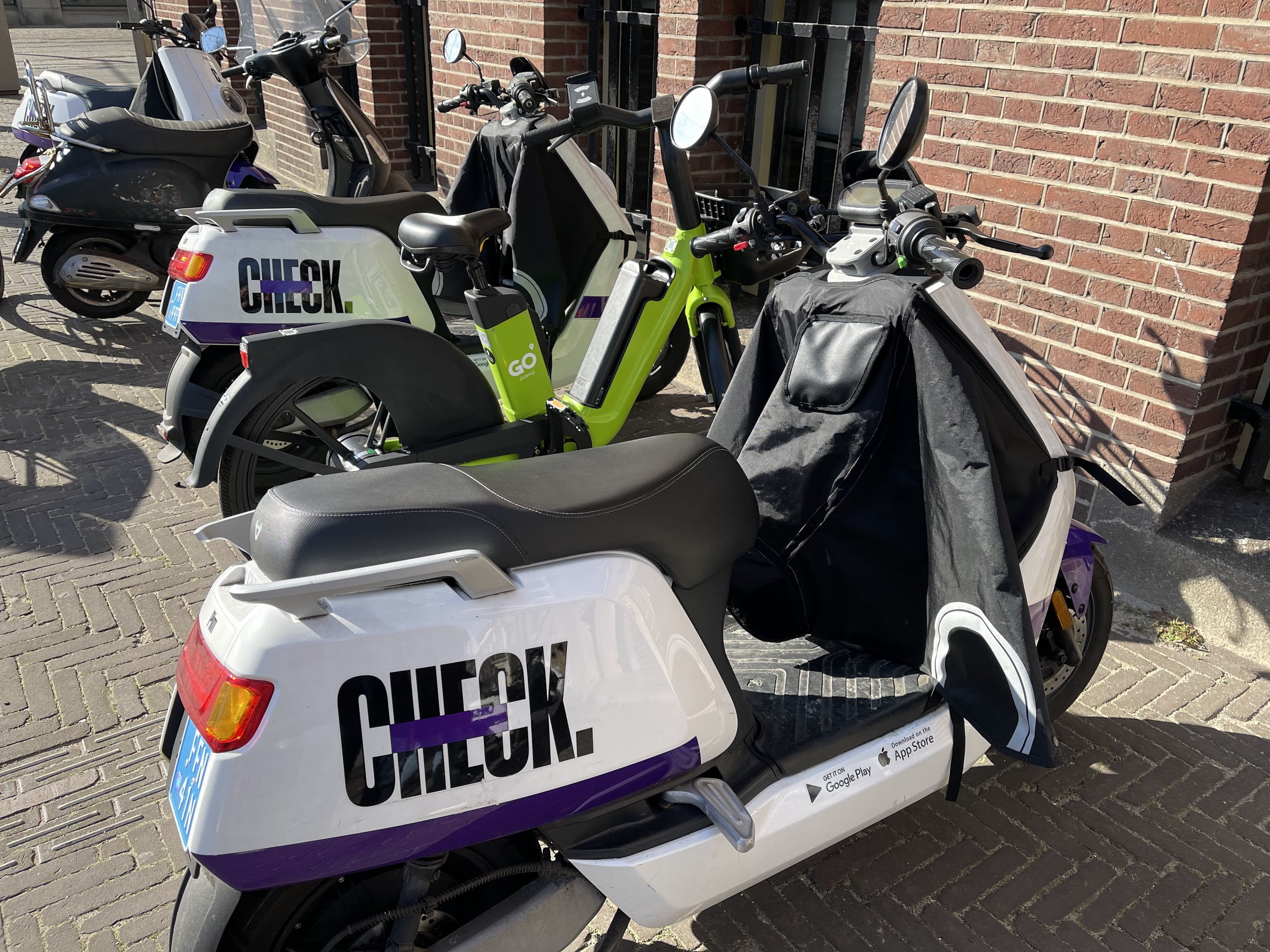 Possible scooter sharing drama in the streets of Amsterdam